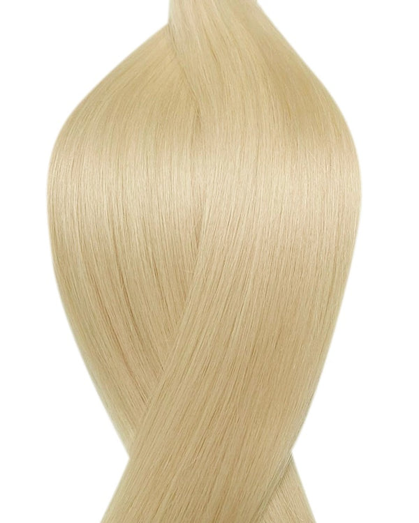 Naturalne włosy do przedłużania metoda secret tape on w kolorze platynowy blond.