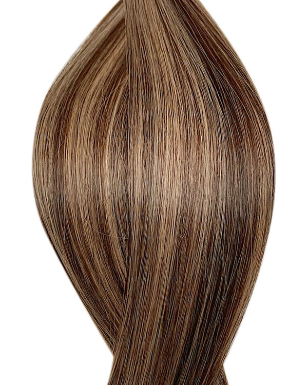Naturalne włosy do przedłużania metoda tape on w kolorze balejaż ciemny brąz i ciemny blond.