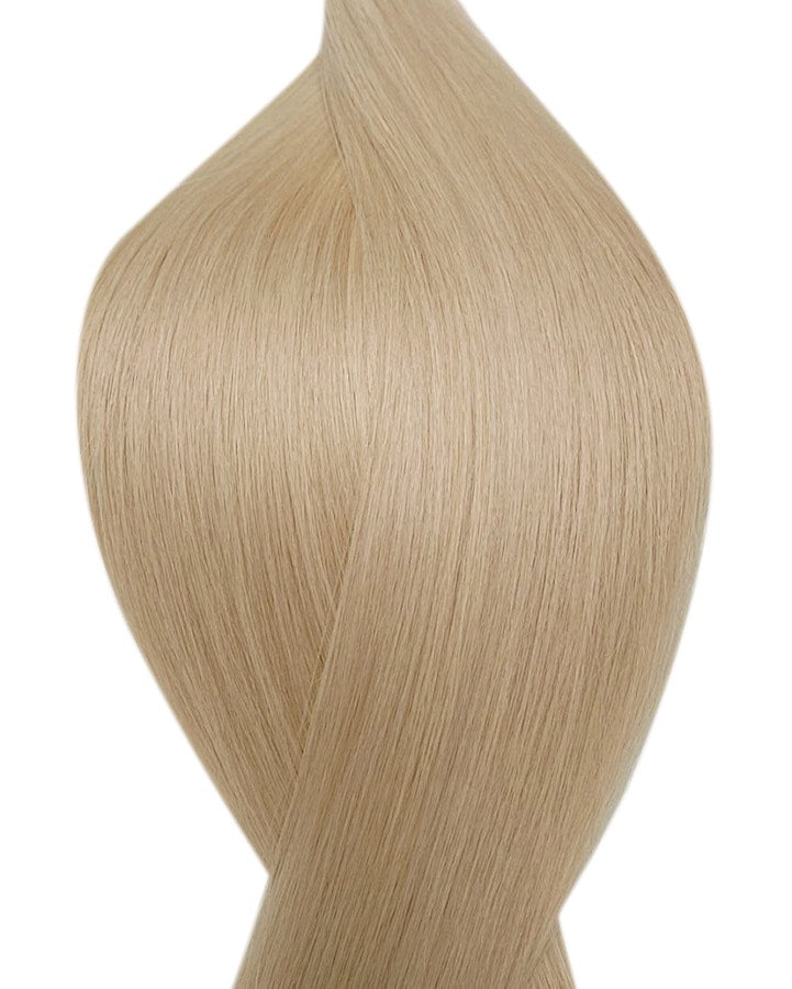 Naturalne włosy do przedłużania metoda na keratynę w kolorze średni popielaty blond.